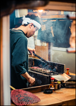 Japanese chef cooking on BBQ