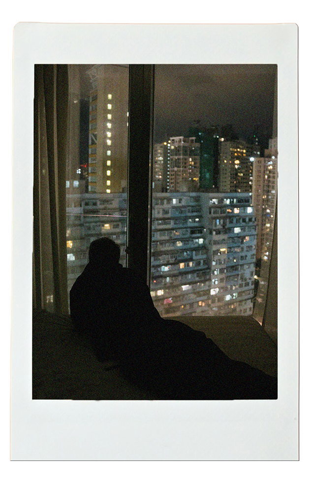 Polaroid of a skyline view from a bedroom